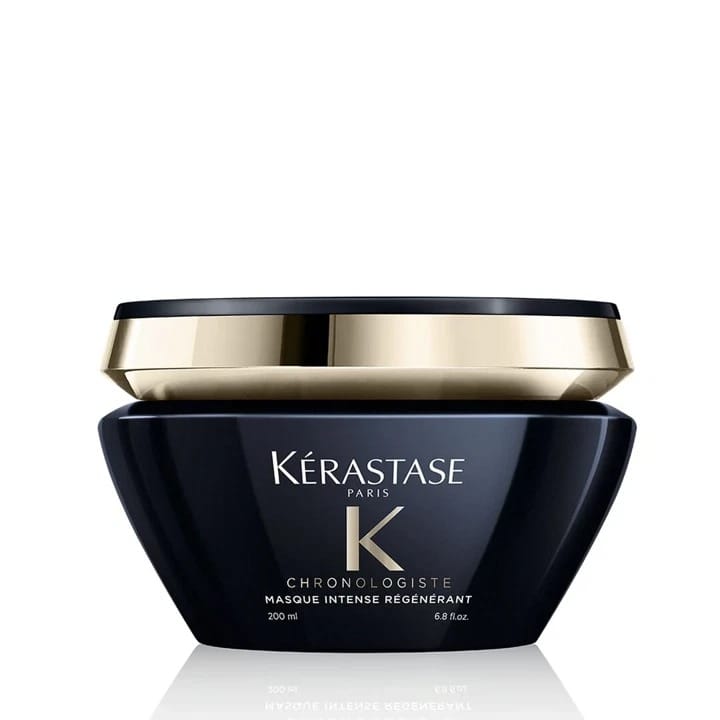 Kérastase Chronologiste Intense Regenerating Mask jar in a dark navy blue container with a metallic gold band and white lettering, on a white background.