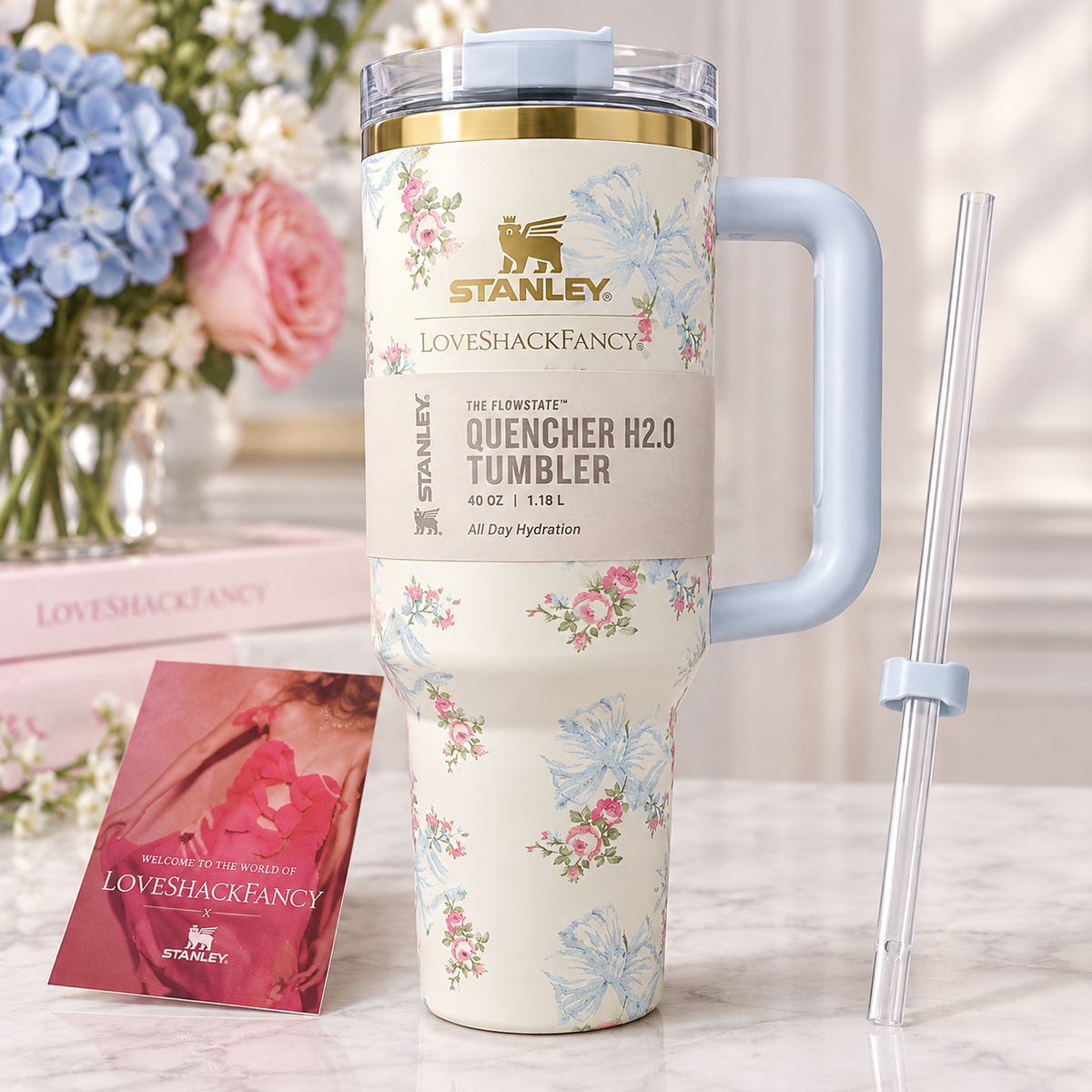 Stanley x LoveShackFancy Quencher H2.0 FlowState 40oz floral stainless steel tumbler with reusable straw, handle, and original gift box.